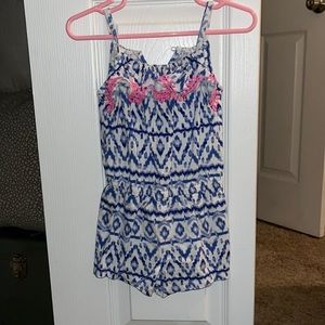 2T patterned romper blue and white with cute pink Pom poms